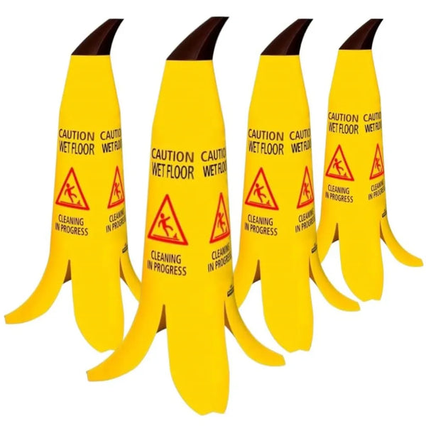 A set of four yellow banana shaped caution cones